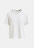 T-shirt in cotone bianco sporco e argento con decorazioni metallizzate tipo perla
