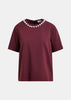 T-shirt in cotone bordeaux e argento con decorazioni metallizzate tipo perla