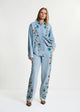 Camicia in denim blu e multicolore con applicazioni floreali di paillettes. ICKSONVILLE001 ESSENTIEL